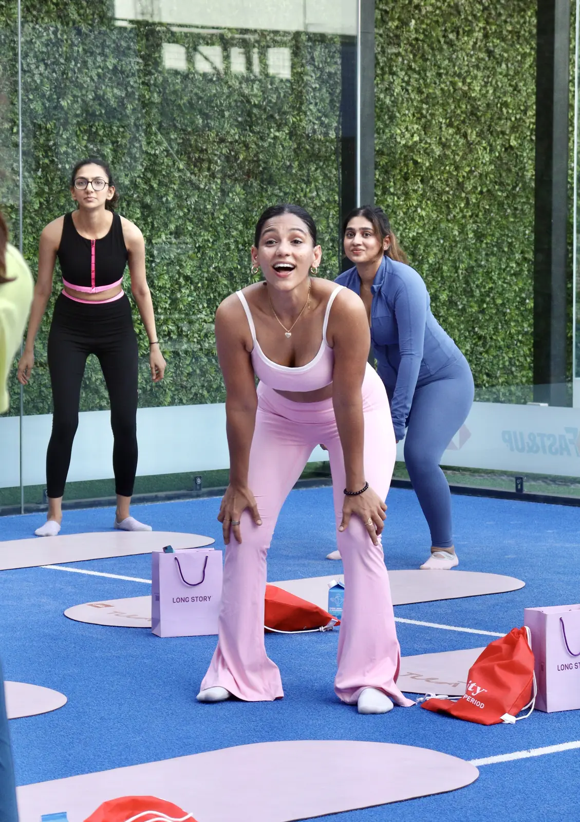 Laughing through a squat with the group at an event